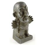 A late 19thC metal sculpture, modelled in the form of William Gladstone as a cartoon character, 12cm