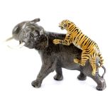 A Beswick ceramic model of an elephant, being attacked by a tiger, 30cm H.