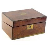 A Victorian figured walnut and brass inlaid writing box, the hinged lid enclosing a tooled black