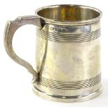 A George V silver christening mug, of cylindrical form, decorated with reeded bands, Birmingham