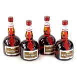 Four bottles of Grand Marnier.