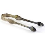 A pair of George III silver sugar tongs, each side of shaped form, London 1805, 1oz.