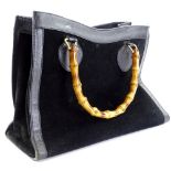 A Gucci bamboo top handle bag, in black suede, with brass hardware (interior AF), 23cm H, 34cm W,