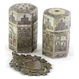 An Egyptian white coloured metal part cruet, decorated with figures, stamped to the underside 84 and