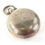 A silver circular Vesta case, with engine turned decoration, Birmingham assay, date letter