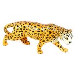 A Beswick pottery model of a leopard, 30cm L.