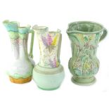 Three items of Beswick pottery to include two similar Art Deco ewers, each decorated with flowers or