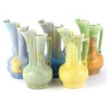 A collection of five Beswick pottery ewers, each of similar form and decorated with a mottled or