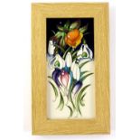 A Moorcroft porcelain rectangular Snowtime pattern plaque, decorated with snow drops, etc., in oak