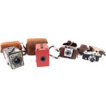 A Halina 35X camera, with 1:3.5X=45mm lens, 6-20 Brownie E camera, Kodak Colorsnap 35 camera model