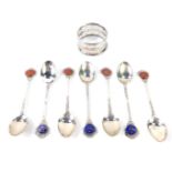 A silver napkin ring, Sheffield 1956, 0.48oz, together with six coffee spoons with enamel terminals,