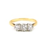 An 18ct gold and diamond three stone ring, approx 0.8cts, size K, 2.2g.