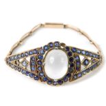 An early 20thC moonstone and sapphire set bracelet, of articulated form, on a rectangular link strap