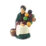 A Royal Doulton figure modelled a The Old Balloon Seller, HN1315, 22cm H.