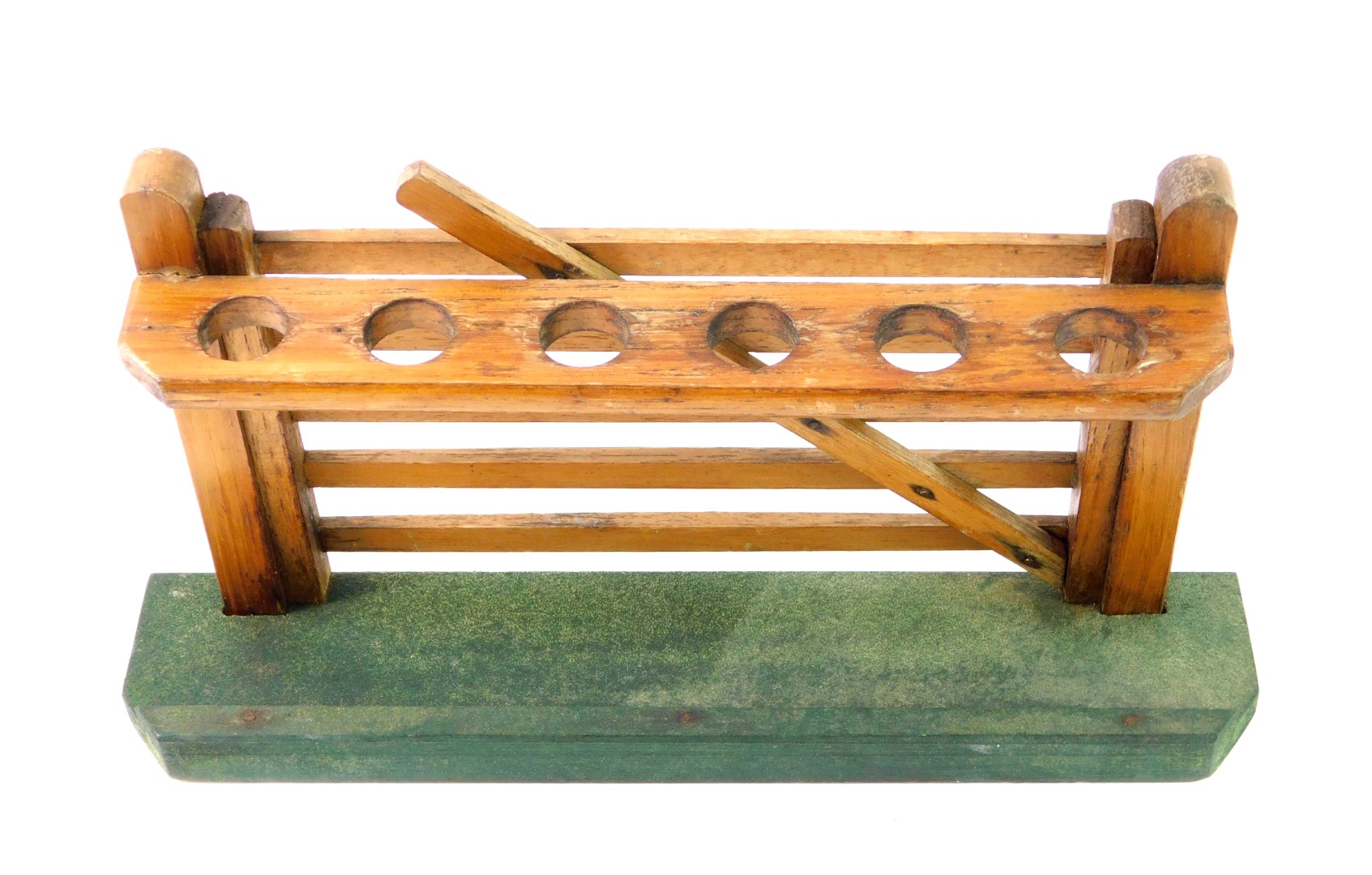 An early 20thC oak pipe rack, formed as a six bar gate, on a green beize covered base, 28cm W. - Image 2 of 2