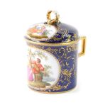 A Berlin 19thC porcelain chocolate pot and cover, reserve decorated with courting figures after