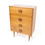 A 1970s teak chest of drawers, with four drawers, raised on angled tapering square legs, 103.5cm