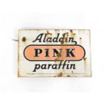 An enamel advertising sign Aladdin Pink Paraffin, black lettering against a pink and white ground,