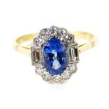 An Art Deco style 18ct gold sapphire and diamond ring, the oval cut sapphire approx 1ct, diamonds