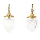 A pair of Edwardian style brass and cut glass ceiling lights, with teardrop shades, and suspension