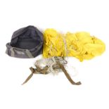 A USAAF T-10 military parachute, yellow, with bag.