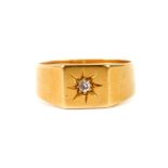 An 18ct gold and diamond gentleman's signet ring, in a star burst setting, size T, 7.1g.