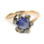 A sapphire and diamond ring, in a crossover floral design, set in rose yellow metal, size O, 3.9g.