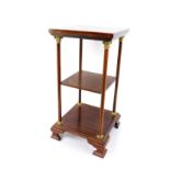 A Georgian style mahogany etagere by John More of Scarborough, of three tier square form, with brass