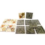 Eight Victorian late 19thC fireside tiles, printed in grey and white with flowers and tendrils, 15.