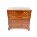 A George III mahogany chest of drawers, with two short over three long graduated drawers, raised