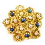 An 18ct gold seed pearl and turquoise brooch, of multi flower form, 13.4g.