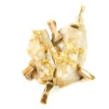 A 9ct gold and Quartz crystal pendant, of abstract design, encrusted with traces of solid gold