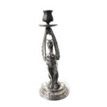 A late 19thC French silver plated candlestick, of figural form, cast with a Griffin, raised on a