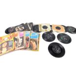 The Beatles 45rpm single records, Apple Records and others, some with slip covers, together with