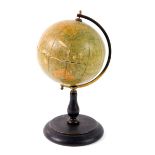 A Philip's early 20thC 6" terrestrial globe, brass framed on an ebonised stand, 28cm H.