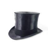 A black silk top hat by James Lock & Co, size 7 3/8, boxed with label, and internal label stating
