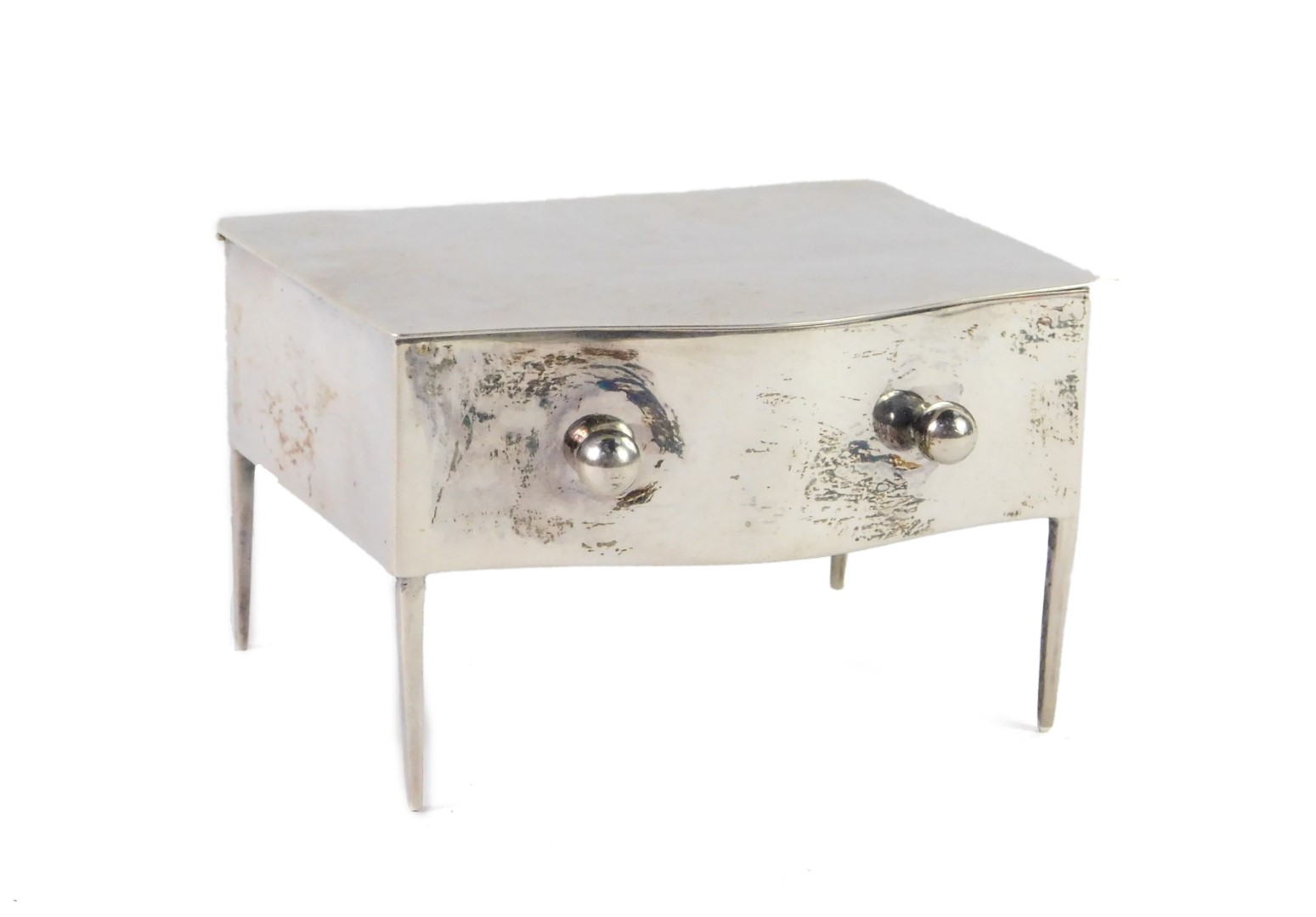 A George V silver novelty jewellery case, modelled as a serpentine fronted table, the hinge lid