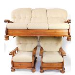 A pine three piece cottage suite, with brown button back cushions and seats, with fluted arms,