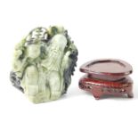 A Chinese jadeite carving of Shou Xing modelled seated with a staff and peach, 17cm H, together with