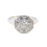 A platinum and diamond nine stone daisy head ring, in an octagonal setting, approx 1ct, size N, 4.