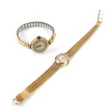 An Accurist lady's 9ct gold circular cased wristwatch, silvered dial with gold batons, on a 9ct gold