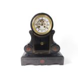 A French late 19thC slate and marble mantel clock, circular enamel dial bearing Roman numerals,