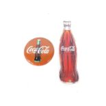 An enamel circular Coca Cola advertising sign, The Coca Cola Company 1990, 27cm Dia, together with a