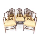 A set of eight Hepplewhite style mahogany dining chairs, with shield shape backs, pierced splats