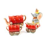 A Sadler pottery three piece covered wagon train tea set, comprising teapot, sucrier and cream