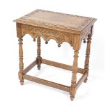 A 17thC style oak side table, with a carved top and friezes, raised on baluster turned columns,