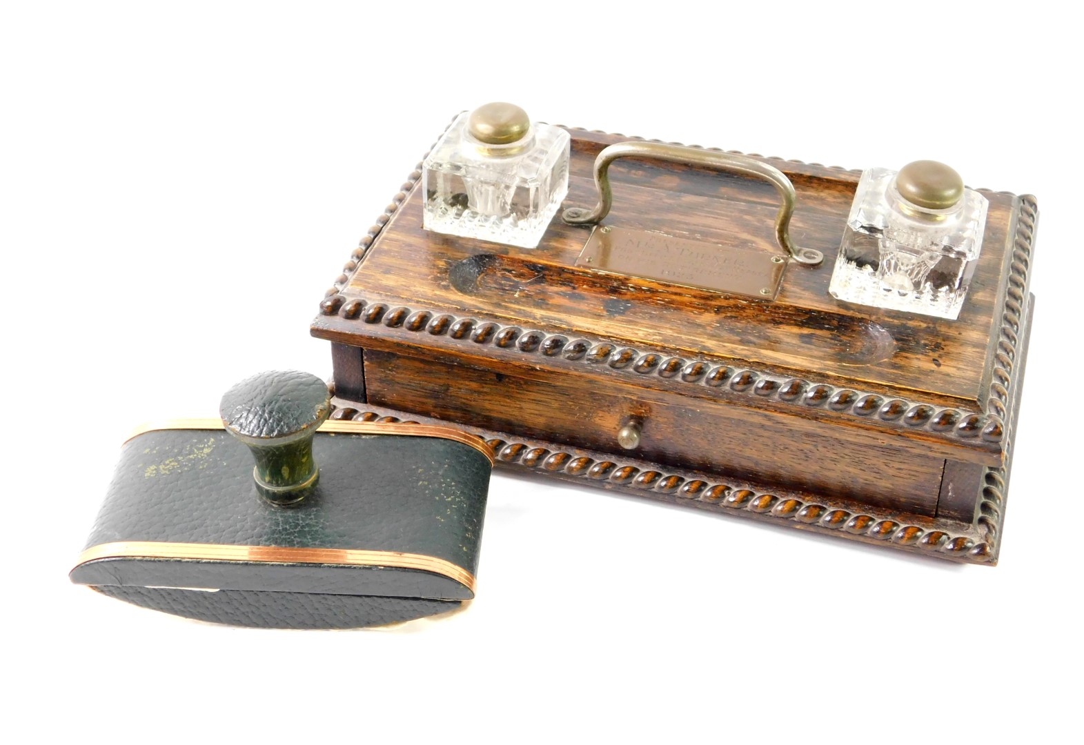 A Victorian oak desk stand, with two glass inkwells, pen recesses over a single frieze drawer,