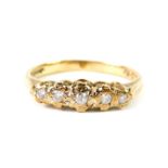 A 9ct gold and diamond five stone ring, illusion set, size L, 2.0g.