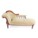 A Victorian mahogany chaise longue, upholstered in green button back draylon, raised on turned legs,