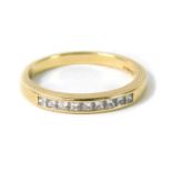 An 18ct gold and diamond half hoop eternity ring, channel set with nine princess cut diamonds,